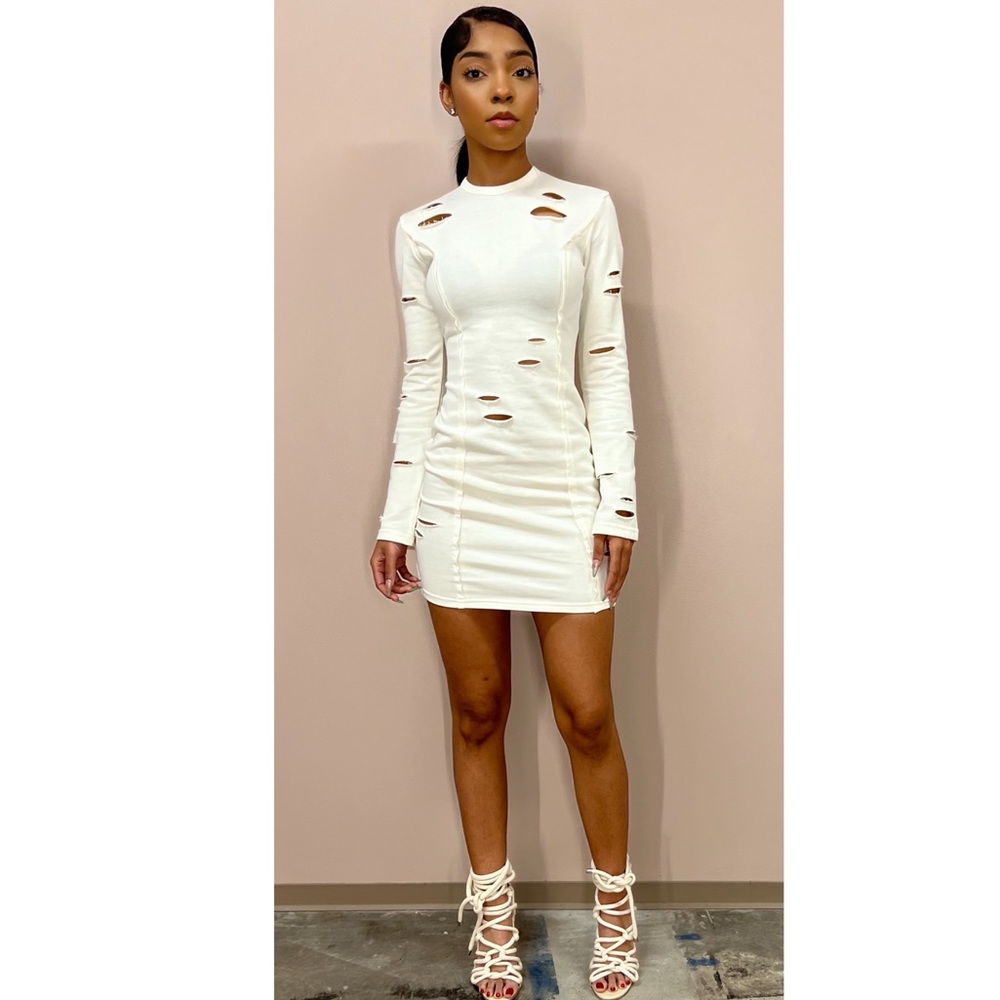 Great Material Cream Colored Dress With Slits ( holes). Long Sleeve.